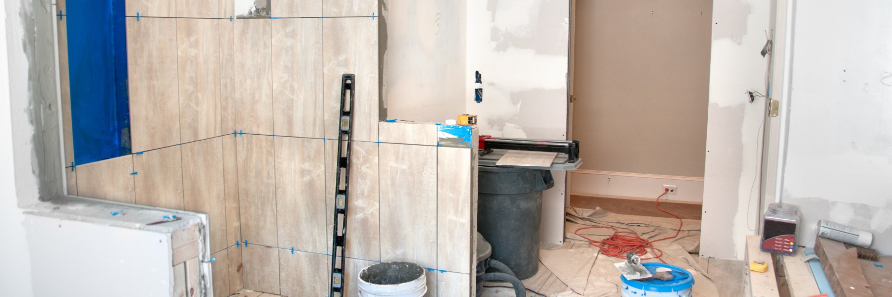 Bathroom shower being tiled during a remodel