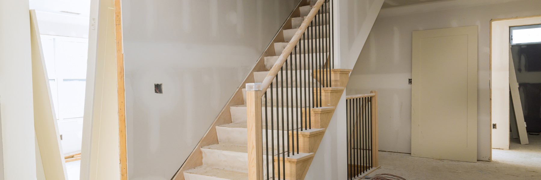 Home renovation with new drywall and staircase